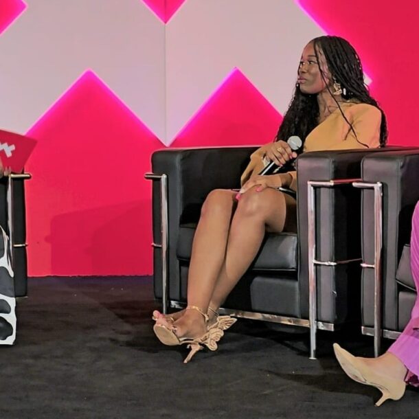 Alicia Lyttle speaks on stage at the ESSENCE Festival, leading a panel discussion focused on AI education for entrepreneurs.