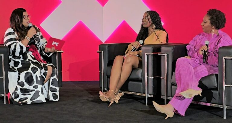Alicia Lyttle speaks on stage at the ESSENCE Festival, leading a panel discussion focused on AI education for entrepreneurs.