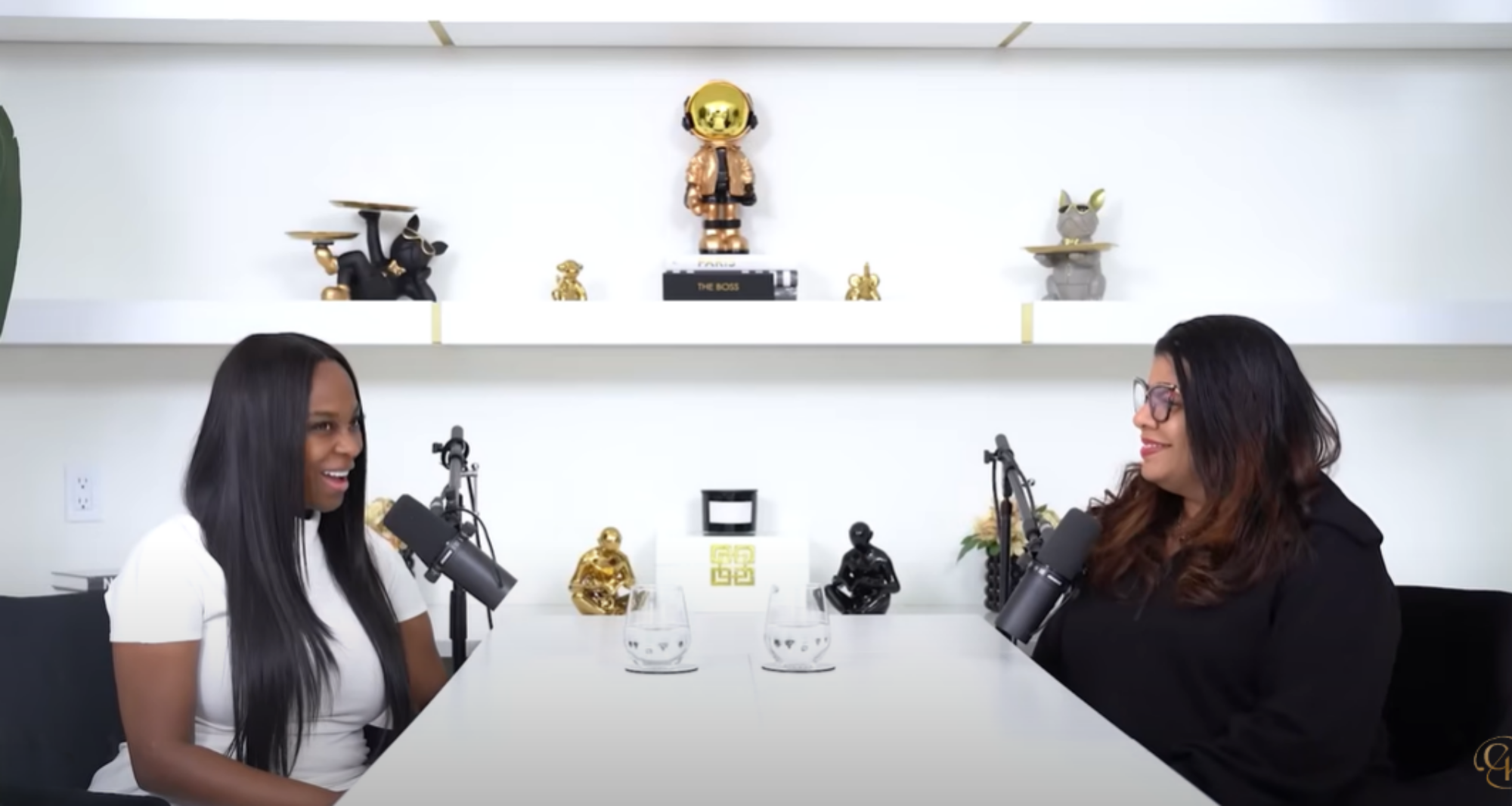 A podcast interview about AI for Entrepreneurs featuring Alicia Lyttle and Coach K, recorded in a bright studio with modern decor and professional microphones.
