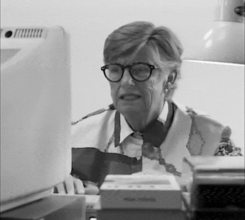 Frustrated elderly person pulling their hair while looking at a computer screen, illustrating the stress of manual meeting coordination before Google Gemini scheduling.